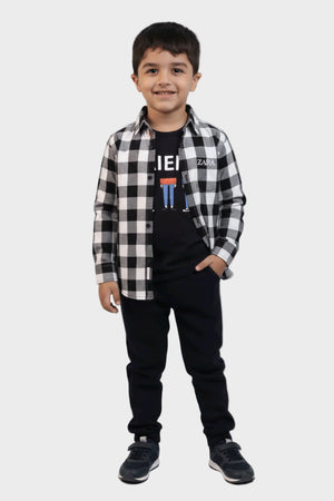Stylish Squad Child wearing a black and white checkered shirt over a black t-shirt with visible branding, standing against a plain background.